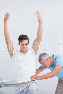 Doctor examining his patient back