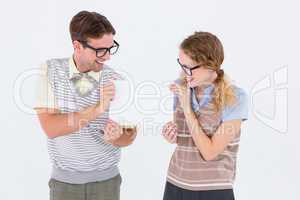 Geeky hipster couple holding poster