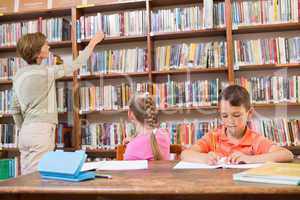 Teacher looking for a book at library