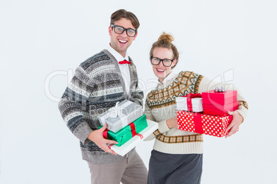 Geeky hipster couple holding presents