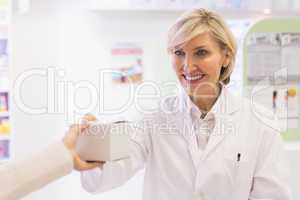 Pharmacist taking medicine to costumer