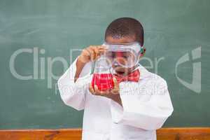 Surprise pupil looking at a red liquid