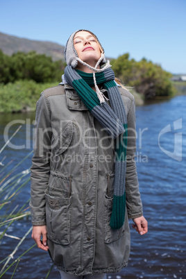 Happy casual woman at a lake