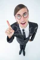 Geeky businessman pointing up