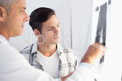 Doctor showing X rays to his patient