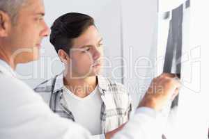 Doctor showing X rays to his patient