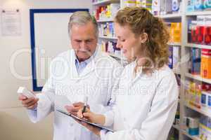 Pharmacists looking a medication for a prescription