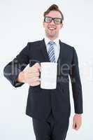 Happy geeky businessman holding coffee mug