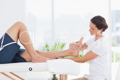 Physiotherapist doing leg massage