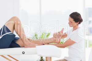 Physiotherapist doing leg massage