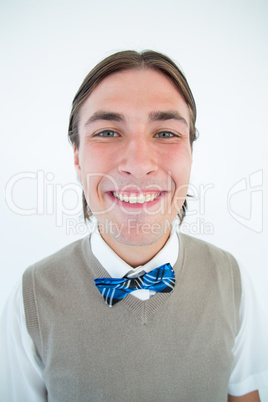 Geeky hipster smiling at camera and showing teeth