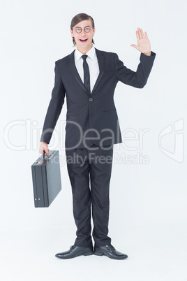 Geeky businessman waving at camera