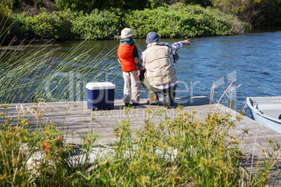 Happy man fishing with his son