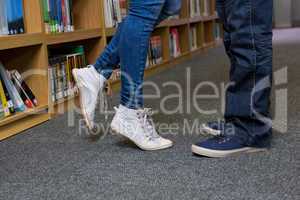 Cute couple embracing each other in the library