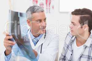 Doctor showing X rays to his patient