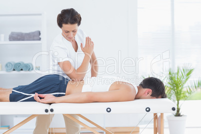 Physiotherapist doing back massage Physiotherapist doing back massage