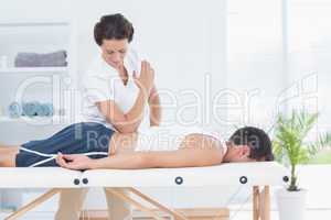 Physiotherapist doing back massage