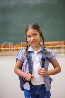 Cute pupil smiling at camera