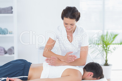 Physiotherapist doing back massage