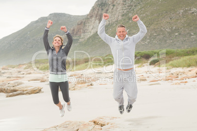 Fit couple smiling at camera