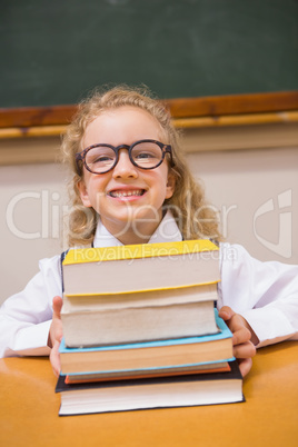 Smiling pupil holding books Smiling pupil holding books