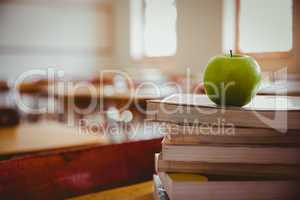 Apple on pile of books