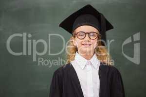 Cute pupil in graduation robe