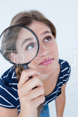 Woman holding magnifying glass