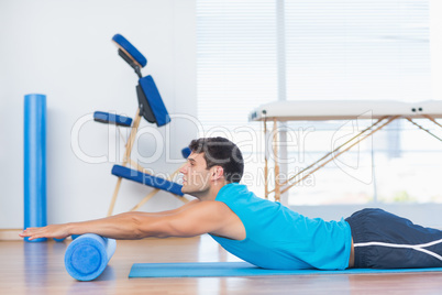 Man exercising with foam roller