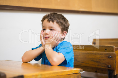 Focus pupil sitting at his desk
