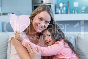 Happy mother and daughter on the couch