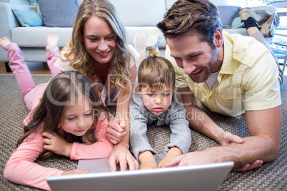 Happy family using the laptop