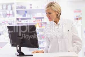 Pharmacist using the computer