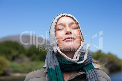 Happy casual woman at a lake