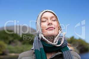 Happy casual woman at a lake