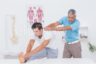 Doctor examining his patient back