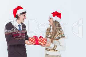 Geeky hipster couple holding present