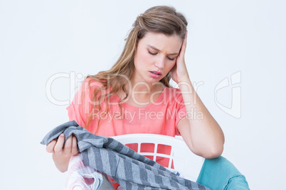 Hipster looking at laundry basket