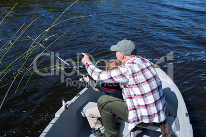 Happy man fishing with his son