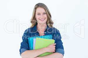 Smiling student holding notebook and file