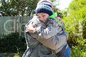 Father and son hugging