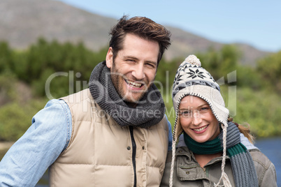 Happy casual couple at a lake