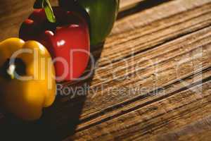 Three peppers on chopping board