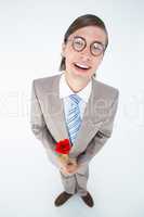 Geeky lovesick hipster holding rose