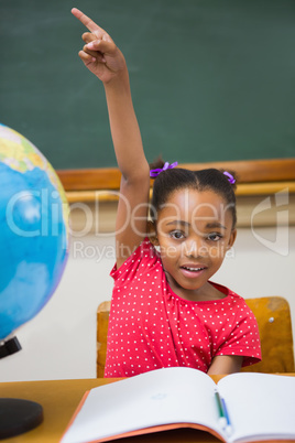 Pupil raising her hand during class