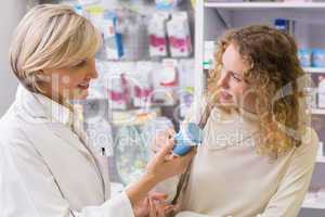 Pharmacist and customer talking about medication