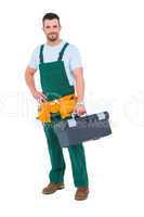 Smiling carpenter with toolbox