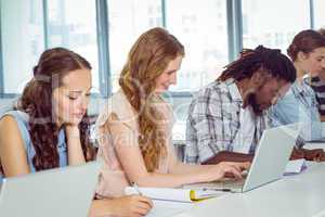 Fashion students using laptop