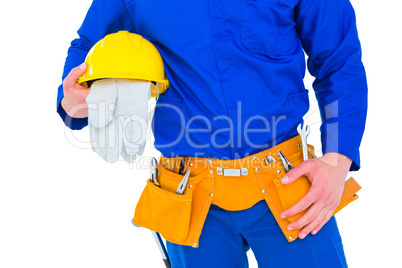 Handyman holding helmet