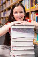 Student sitting on floor in library